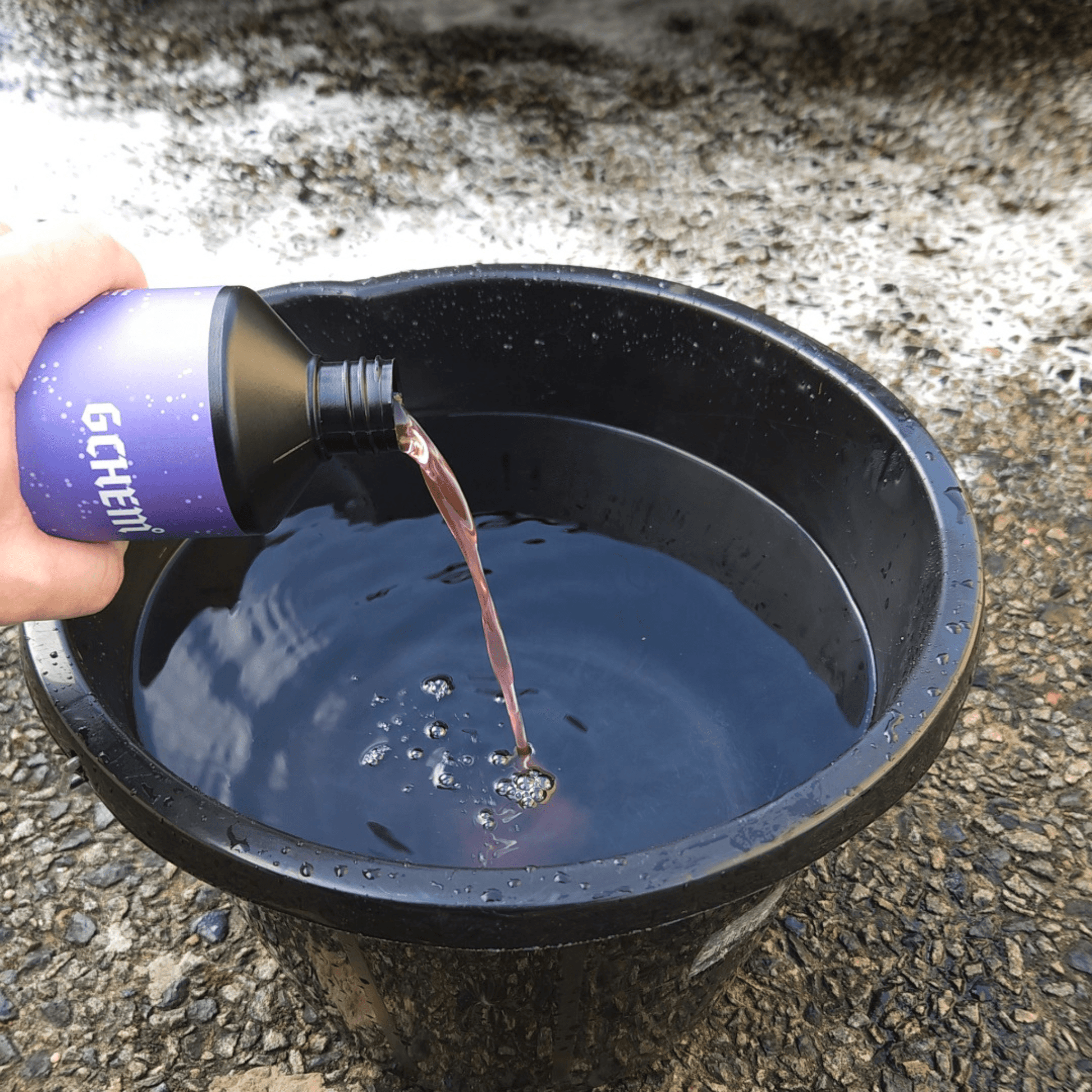 gchem biosuds biosurfactant car shampoo being poured into black bucket