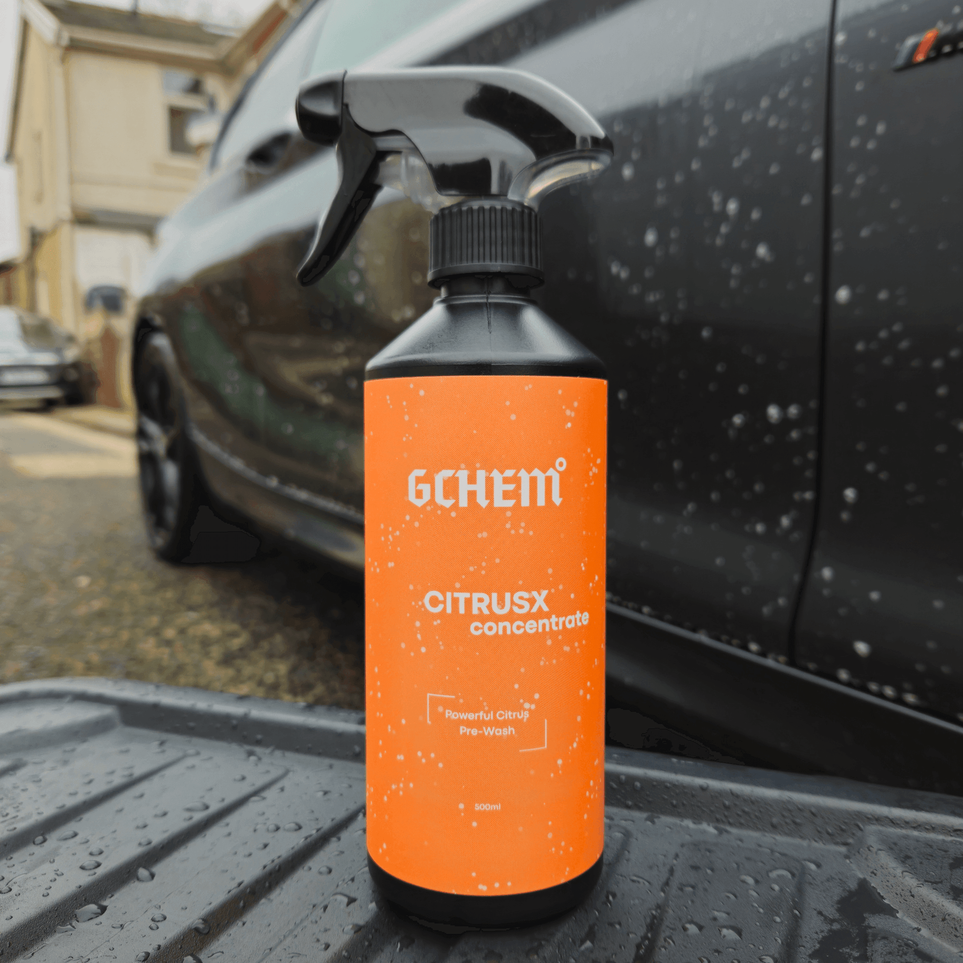 gchem citrus pre wash car cleaner orange label in front of grey BMW M140i